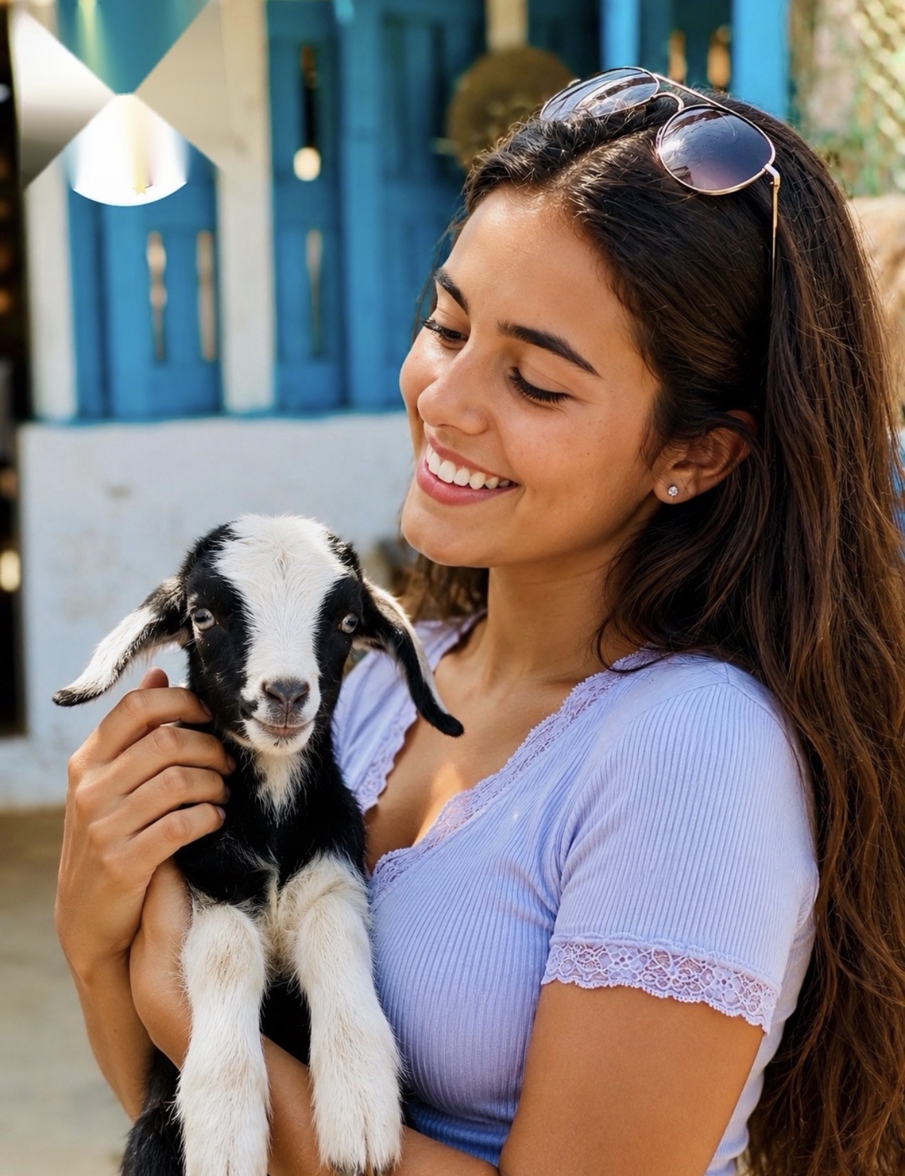 Visitante com uma cabra bebé na Boa Vista